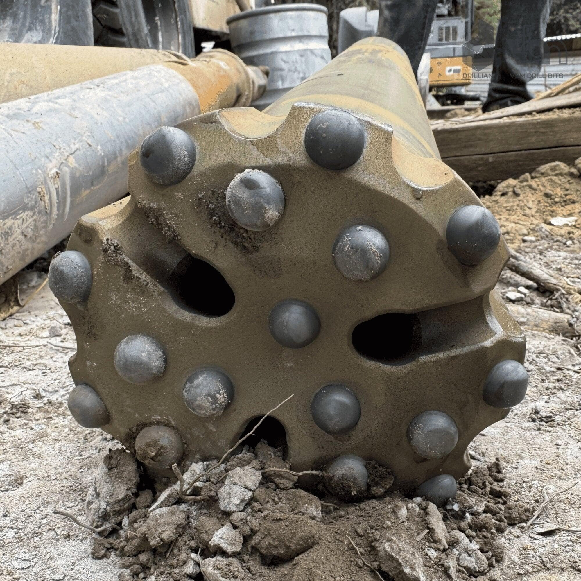DTH bit face and M60 shank after 450 ft of hard rock drilling showing intact dome TCI buttons and full gauge